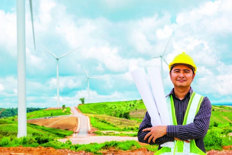 Engineer worker at wind turbine power station construction site